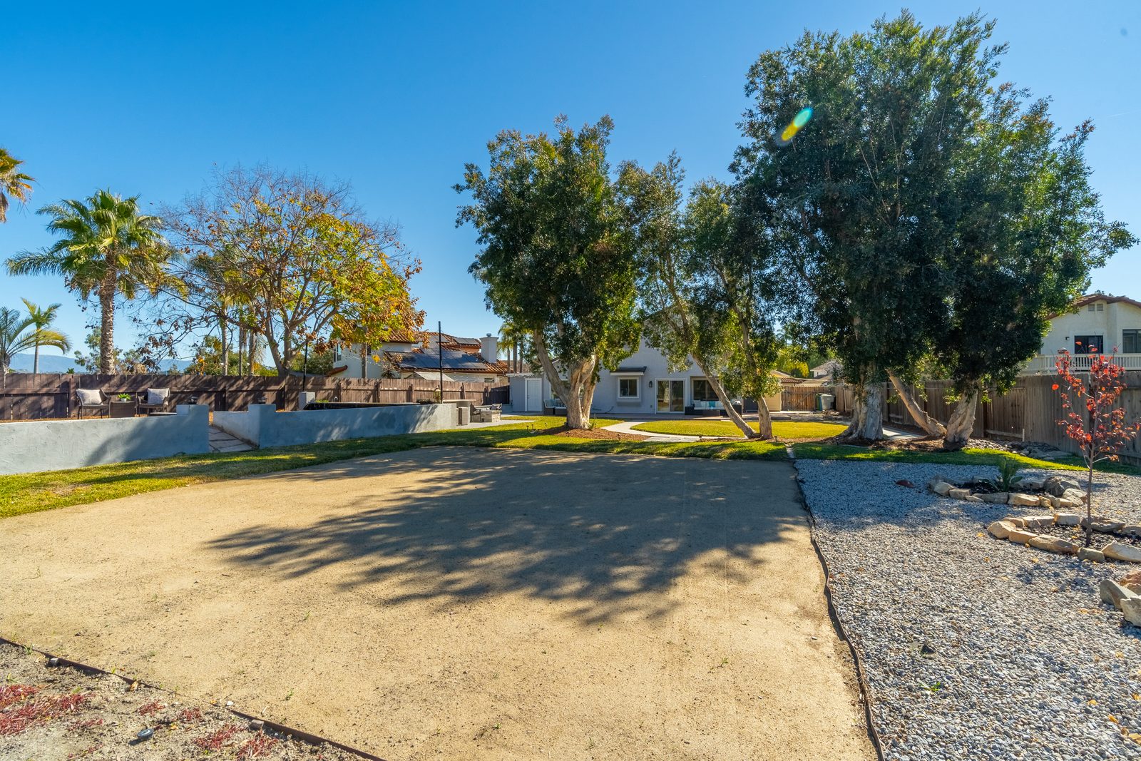 Backyard after: lawn, walkways, planting beds, defined seating areas